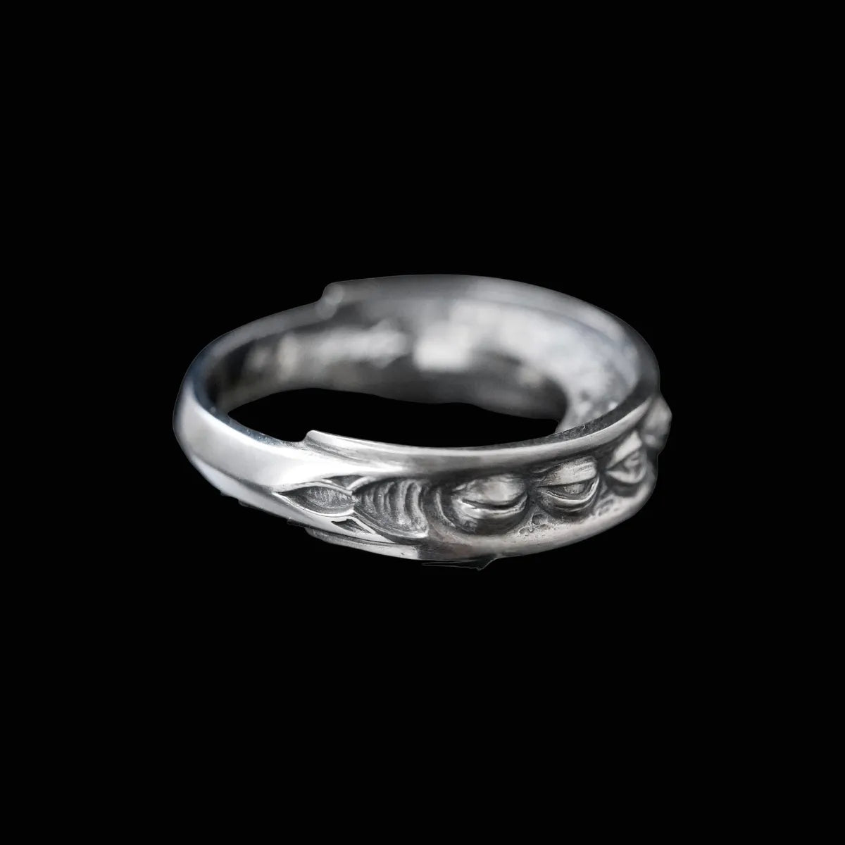 Side view of Lunation Eye Ring, highlighting the thick band and the carved, cratered texture of the lunar surface.