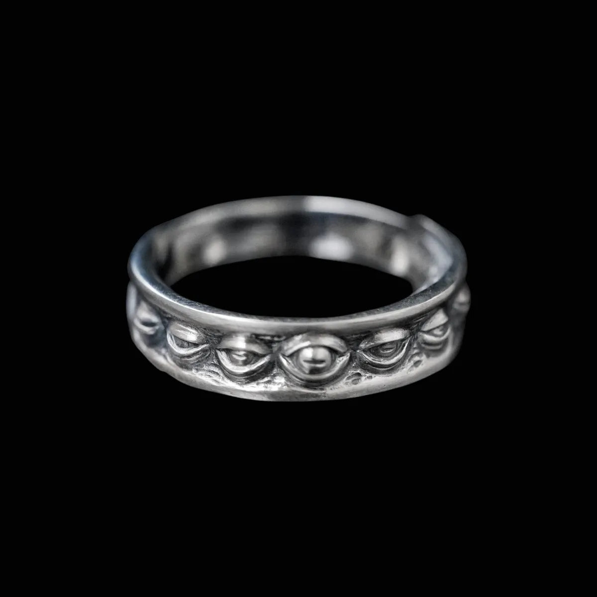 Oxidized silver Lunation Eye Ring, front view detail, showing the central carved eye representing the phases of the moon.