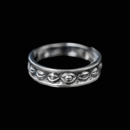 Oxidized silver Lunation Eye Ring, front view detail, showing the central carved eye representing the phases of the moon.