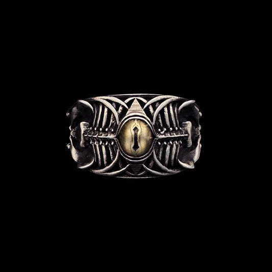 Close-up of Sin-Bearer's Gaze Ring, oxidized silver Ram skull design with central yellow cat-eye stone.