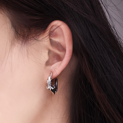 Handmade 925 sterling silver stud earring by QITREASURES, featuring an intricate Gothic Fleur-de-lis motif with a dark oxidized silver finish.