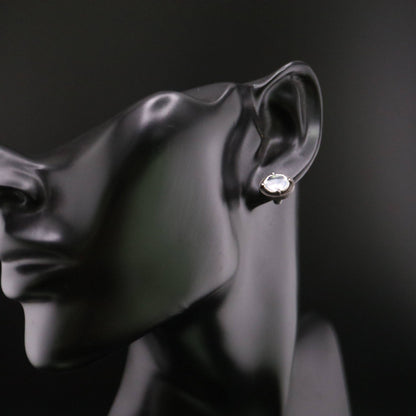 Handmade 925 sterling silver stud earring featuring a polished mirror-like center in an oxidized silver industrial frame.