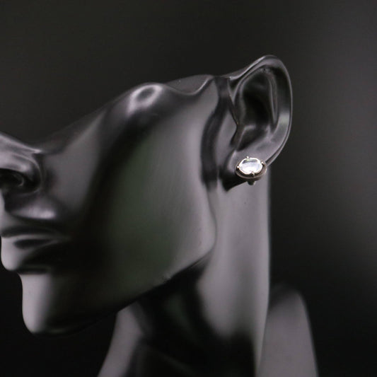 Handmade 925 sterling silver stud earring featuring a polished mirror-like center in an oxidized silver industrial frame.