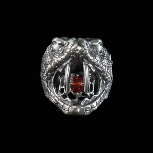 Men's oxidized silver snake ring, Fanged Resolve, with ruby gemstone for strength and transformation.